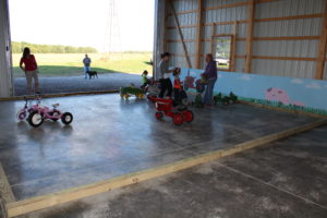 Tricycle and toy tractor riding area