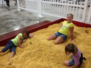 Kids playing in cornbox